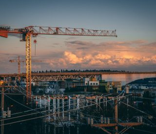 A beautiful view of a construction site in a city during sunset